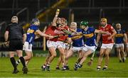 22 February 2025; Luke Meade of Cork attempts to get a handpass away while under pressure from Alan Tynan and /t22during the Allianz Hurling League Division 1A match between Tipperary and Cork at FBD Semple Stadium in Thurles, Tipperary. Photo by Brendan Moran/Sportsfile