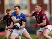 23 February 2025; Gearoid McKiernan of Cavan in action against  Westmeath players, from left, Ronan Wallace and Conor Dillon during the Allianz Football League Division 2 match between Westmeath and Cavan at TEG Cusack Park in Mullingar, Westmeath. Photo by Michael P Ryan/Sportsfile
