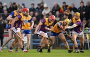 23 February 2025; Conor Hearne of Wexford attempts to gather possession ahead of teammates Lee Chin and Damien Reck and Mark Rodgers of Clare during the Allianz Hurling League Division 1A match between Clare and Wexford at Cusack Park in Ennis, Clare. Photo by Brendan Moran/Sportsfile