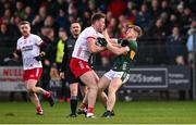 23 February 2025; Brian Kennedy of Tyrone and Damien Bourke of Kerry during the Allianz Football League Division 1 match between Tyrone and Kerry at Pomeroy Plunkett's GAA Club in Pomeroy, Tyrone. Photo by Ramsey Cardy/Sportsfile