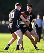 23 February 2025; Andy McDonnell of Louth in action against Odhran Murdock, left, and James Guinness of Down during the Allianz Football League Division 2 match between Louth and Down at Integral GAA Grounds in Drogheda, Louth. Photo by Tyler Miller/Sportsfile