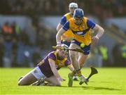 23 February 2025; Rory Hayes of Clare in action against Cian Byrne of Wexford during the Allianz Hurling League Division 1A match between Clare and Wexford at Cusack Park in Ennis, Clare. Photo by John Sheridan/Sportsfile