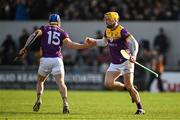 23 February 2025; Séamus Casey of Wexford, left, celebrates with teammate Damien Reck after scoring their side's fist goal during the Allianz Hurling League Division 1A match between Clare and Wexford at Cusack Park in Ennis, Clare. Photo by Brendan Moran/Sportsfile