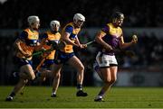 23 February 2025; Jack O’Connor of Wexford races clear of Ryan Taylor and Cian Galvin of Clare during the Allianz Hurling League Division 1A match between Clare and Wexford at Cusack Park in Ennis, Clare. Photo by Brendan Moran/Sportsfile