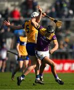 23 February 2025; Jack O’Connor of Wexford is tackled by Cian Galvin of Clare during the Allianz Hurling League Division 1A match between Clare and Wexford at Cusack Park in Ennis, Clare. Photo by Brendan Moran/Sportsfile