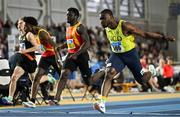 23 February 2025; Bori Akinola of UCD AC, Dublin, right, crosses the line to win the men's 60m final ahead of Israel Olatunde of Tallaght AC, Dublin, centre, who finished third, during day two of the 123.ie National Senior Indoor Championships at the National Indoor Arena on the Sport Ireland Campus in Dublin. Photo by Sam Barnes/Sportsfile