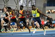 23 February 2025; Bori Akinola of UCD AC, Dublin, right, crosses the line to win the men's 60m final ahead of Israel Olatunde of Tallaght AC, Dublin, centre, who finished third, during day two of the 123.ie National Senior Indoor Championships at the National Indoor Arena on the Sport Ireland Campus in Dublin. Photo by Sam Barnes/Sportsfile