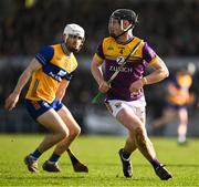 23 February 2025; Conor Foley of Wexford in action against Aidan McCarthy of Clare during the Allianz Hurling League Division 1A match between Clare and Wexford at Cusack Park in Ennis, Clare. Photo by Brendan Moran/Sportsfile