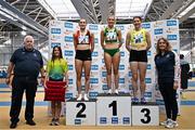 22 February 2025; Athletics Ireland president John Cronin, far left, and Athletics Ireland Deputy President Brid Golden, far right, with women's 200m medallists, Katie Bergin of Moyne AC, Tipperary, gold, centre, Kate O'Connell of Lucan Harriers AC, Dublin, silver, left, and Molly Hourihan of UCD AC, Dublin, bronze, right, during day one of the 123.ie National Senior Indoor Championships at the National Indoor Arena on the Sport Ireland Campus in Dublin. Photo by Sam Barnes/Sportsfile