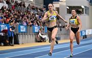 22 February 2025; Rachel McCann of North Down AC, left, on her way to winning her women's 400m semi-final ahead of Phil Healy of Bandon AC, Cork, during day one of the 123.ie National Senior Indoor Championships at the National Indoor Arena on the Sport Ireland Campus in Dublin. Photo by Sam Barnes/Sportsfile