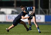 25 February 2025; Sam Cunningham of St Vincent's Castleknock College is tackled by Sean Lee of Wesley College during the Bank of Ireland Leinster Rugby Boys Schools Junior Cup second round match between Wesley College and St Vincent's Castleknock College at Energia Park in Dublin. Photo by Daire Brennan/Sportsfile