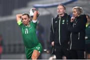 25 February 2025; Katie McCabe of Republic of Ireland takes a throw-in, watched by Republic of Ireland head coach Carla Ward and assistant head coach Alan Mahon, during the UEFA Women's Nations League B match between Slovenia and Republic of Ireland at Bonifika Stadium in Koper, Slovenia. Photo by Stephen McCarthy/Sportsfile