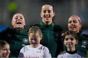 25 February 2025; Republic of Ireland players, from left, Lucy Quinn, Anna Patten and Denise O’Sullivan sing the National Anthem before the UEFA Women's Nations League B match between Slovenia and Republic of Ireland at Bonifika Stadium in Koper, Slovenia. Photo by Stephen McCarthy/Sportsfile