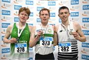 23 February 2025; Men's 3000m medallists, Sean Tobin of Clonmel AC, Tipperay, centre, gold, James Gormley of Carmen Runners, silver, centre left, and Callum Morgan of CNDR Track AC, bronze, centre right, during day two of the 123.ie National Senior Indoor Championships at the National Indoor Arena on the Sport Ireland Campus in Dublin. Photo by Sam Barnes/Sportsfile