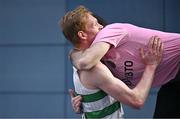 23 February 2025; Sean Tobin of Clonmel AC, Tipperary, celebrates with coach Feidhlim Kelly after winning the men's 3000m during day two of the 123.ie National Senior Indoor Championships at the National Indoor Arena on the Sport Ireland Campus in Dublin. Photo by Sam Barnes/Sportsfile
