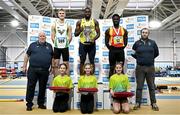 23 February 2025; Athletics Ireland president John Cronin, far left, and Athletics Ireland chair of competitions Andrew Lynam, far right, with men's 60m medallists, Bori Akinola of UCD AC, Dublin, gold, centre, Max O'Reilly of Riverstick/Kinsale AC, Cork, silver, left, and Israel Olatunde of Tallaght AC, Dublin, bronze, right, during day two of the 123.ie National Senior Indoor Championships at the National Indoor Arena on the Sport Ireland Campus in Dublin. Photo by Sam Barnes/Sportsfile