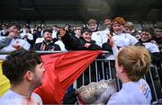 26 February 2025; Presentation College, Bray supporter Caleb Doyle, centre, celebrates with players after the Bank of Ireland Leinster Rugby Boys Schools Vinnie Murray Cup final match between Temple Carrig School and Presentation College, Bray at Energia Park in Dublin. Photo by Shauna Clinton/Sportsfile