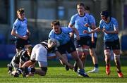27 February 2025; Joshua Neville of St Michael's College is tackled by Adam Keeling of Belvedere College during the Bank of Ireland Leinster Rugby Boys Schools Junior Cup second round match between St Michael's College and Belvedere College at Energia Park in Dublin. Photo by Shauna Clinton/Sportsfile