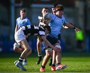 27 February 2025; Dara Elliott of St Michael's College is tackled by Adam Keeling of Belvedere College during the Bank of Ireland Leinster Rugby Boys Schools Junior Cup second round match between St Michael's College and Belvedere College at Energia Park in Dublin. Photo by Shauna Clinton/Sportsfile