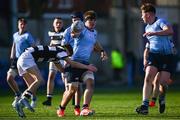 27 February 2025; Dara Elliott of St Michael's College is tackled by Adam Keeling of Belvedere College during the Bank of Ireland Leinster Rugby Boys Schools Junior Cup second round match between St Michael's College and Belvedere College at Energia Park in Dublin. Photo by Shauna Clinton/Sportsfile