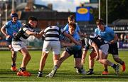 27 February 2025; Sam Dunne of St Michael's College is tackled by Belvedere College players Elliot Scanlan, left, and Conor Stafford during the Bank of Ireland Leinster Rugby Boys Schools Junior Cup second round match between St Michael's College and Belvedere College at Energia Park in Dublin. Photo by Shauna Clinton/Sportsfile