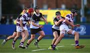 27 February 2025; Lucas Aveling of Clongowes Wood College is tackled by Donal Larkin of Newbridge College during the Bank of Ireland Leinster Rugby Boys Schools Junior Cup second round match between Clongowes Wood College and Newbridge College at Energia Park in Dublin. Photo by Shauna Clinton/Sportsfile