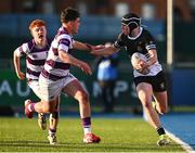27 February 2025; Donal Larkin of Newbridge College is tackled by Tom English of Clongowes Wood College during the Bank of Ireland Leinster Rugby Boys Schools Junior Cup second round match between Clongowes Wood College and Newbridge College at Energia Park in Dublin. Photo by Shauna Clinton/Sportsfile