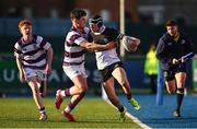 27 February 2025; Donal Larkin of Newbridge College is tackled by Tom English of Clongowes Wood College during the Bank of Ireland Leinster Rugby Boys Schools Junior Cup second round match between Clongowes Wood College and Newbridge College at Energia Park in Dublin. Photo by Shauna Clinton/Sportsfile