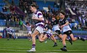 27 February 2025; Victor Lamph of Clongowes Wood College on his way to scoring a try during the Bank of Ireland Leinster Rugby Boys Schools Junior Cup second round match between Clongowes Wood College and Newbridge College at Energia Park in Dublin. Photo by Shauna Clinton/Sportsfile