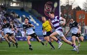 27 February 2025; Victor Lamph of Clongowes Wood College on his way to scoring a try during the Bank of Ireland Leinster Rugby Boys Schools Junior Cup second round match between Clongowes Wood College and Newbridge College at Energia Park in Dublin. Photo by Shauna Clinton/Sportsfile