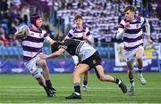 27 February 2025; Senan Walsh of Clongowes Wood College is tackled by Jack Scott of Newbridge College during the Bank of Ireland Leinster Rugby Boys Schools Junior Cup second round match between Clongowes Wood College and Newbridge College at Energia Park in Dublin. Photo by Shauna Clinton/Sportsfile