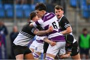 27 February 2025; Philip Kenny of Clongowes Wood College is tackled by Newbridge College players Adam Hathaway, left, and Cian Brennan during the Bank of Ireland Leinster Rugby Boys Schools Junior Cup second round match between Clongowes Wood College and Newbridge College at Energia Park in Dublin. Photo by Shauna Clinton/Sportsfile