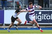 27 February 2025; Tom English of Clongowes Wood College in action against Eoin Gibbons of Newbridge College during the Bank of Ireland Leinster Rugby Boys Schools Junior Cup second round match between Clongowes Wood College and Newbridge College at Energia Park in Dublin. Photo by Shauna Clinton/Sportsfile