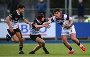 27 February 2025; Tom English of Clongowes Wood College is tackled by Lucas Flynn of Newbridge College during the Bank of Ireland Leinster Rugby Boys Schools Junior Cup second round match between Clongowes Wood College and Newbridge College at Energia Park in Dublin. Photo by Shauna Clinton/Sportsfile