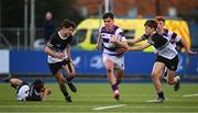 27 February 2025; Tom English of Clongowes Wood College is tackled by Ryan Crawford of Newbridge College during the Bank of Ireland Leinster Rugby Boys Schools Junior Cup second round match between Clongowes Wood College and Newbridge College at Energia Park in Dublin. Photo by Shauna Clinton/Sportsfile