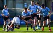 27 February 2025; Joshua Neville of St Michael's College is tackled by Jack Moyles of Belvedere College during the Bank of Ireland Leinster Rugby Boys Schools Junior Cup second round match between St Michael's College and Belvedere College at Energia Park in Dublin. Photo by Shauna Clinton/Sportsfile