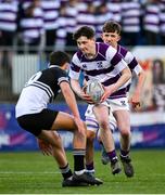 27 February 2025; Scott Morrissey of Clongowes Wood College in action against Jack Scott of Newbridge College during the Bank of Ireland Leinster Rugby Boys Schools Junior Cup second round match between Clongowes Wood College and Newbridge College at Energia Park in Dublin. Photo by Shauna Clinton/Sportsfile