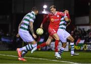 28 February 2025; Sean Boyd of Shelbourne is tackled by Roberto Lopes of Shamrock Rovers during the SSE Airtricity Men's Premier Division match between Shelbourne and Shamrock Rovers at Tolka Park in Dublin. Photo by Stephen McCarthy/Sportsfile