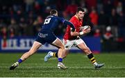 28 February 2025; Calvin Nash of Munster in action against James Lang of Edinburgh during the United Rugby Championship match between Munster and Edinburgh at Virgin Media Park in Cork. Photo by Tyler Miller/Sportsfile