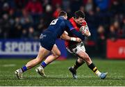 28 February 2025; Calvin Nash of Munster in action against James Lang of Edinburgh during the United Rugby Championship match between Munster and Edinburgh at Virgin Media Park in Cork. Photo by Tyler Miller/Sportsfile