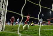 28 February 2025; Aaron McEneff of Shamrock Rovers, left, after scoring their side's first goal past Shelbourne goalkeeper Conor Kearns during the SSE Airtricity Men's Premier Division match between Shelbourne and Shamrock Rovers at Tolka Park in Dublin. Photo by Stephen McCarthy/Sportsfile