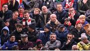 28 February 2025; Spectators, including former Dublin footballers Barry Cahill, Jack McCaffrey, Brian Fenton, Tómas Quinn and Paddy Andrews watch on the SSE Airtricity Men's Premier Division match between Shelbourne and Shamrock Rovers at Tolka Park in Dublin. Photo by Stephen McCarthy/Sportsfile