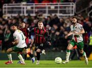 28 February 2025; Ross Tierney of Bohemians in action against Cork City players, from left, Rio Shipston and Greg Bolger during the SSE Airtricity Men's Premier Division match between Cork City and Bohemians at Turner's Cross in Cork. Photo by Michael P Ryan/Sportsfile