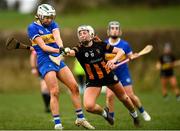 1 March 2025; Clodagh McIntyre of Tipperary is tackled by Niamh Deely of Kilkenny during the Very National Camogie League Division 1A match between between Tipperary and Kilkenny at The Ragg GAA Grounds in Tipperary. Photo by Tom Beary/Sportsfile