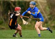 1 March 2025; Julieanna Bourke of Tipperary is tackled by Katie Nolan of Kilkenny during the Very National Camogie League Division 1A match between between Tipperary and Kilkenny at The Ragg GAA Grounds in Tipperary. Photo by Tom Beary/Sportsfile