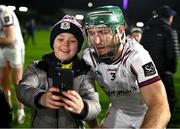 1 March 2025; Fintan Burke of Galway with a young supporter after his side's victory in the Allianz Hurling League Division 1A match between Wexford and Galway at Chadwicks Wexford Park in Wexford. Photo by Stephen Marken/Sportsfile