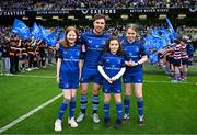 1 March 2025; Leinster captain Luke McGrath with mascots Charlotte, left, and Lucy, right, and Grace Kilcline before the United Rugby Championship match between Leinster and Cardiff Rugby at the Aviva Stadium in Dublin. Photo by Brendan Moran/Sportsfile