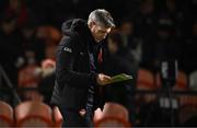 1 March 2025; Armagh manager Kieran McGeeney views the match programme before the Allianz Football League Division 1 match between Armagh and Dublin at the BOX-IT Athletic Grounds in Armagh. Photo by Ben McShane/Sportsfile