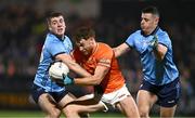 1 March 2025; Jason Duffy of Armagh is tackled by Greg McEneany, left, and Brian Howard of Dublin during the Allianz Football League Division 1 match between Armagh and Dublin at the BOX-IT Athletic Grounds in Armagh. Photo by Ben McShane/Sportsfile