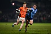 1 March 2025; Conor Turbitt of Armagh in action against Brian Howard of Dublin during the Allianz Football League Division 1 match between Armagh and Dublin at the BOX-IT Athletic Grounds in Armagh. Photo by Ben McShane/Sportsfile